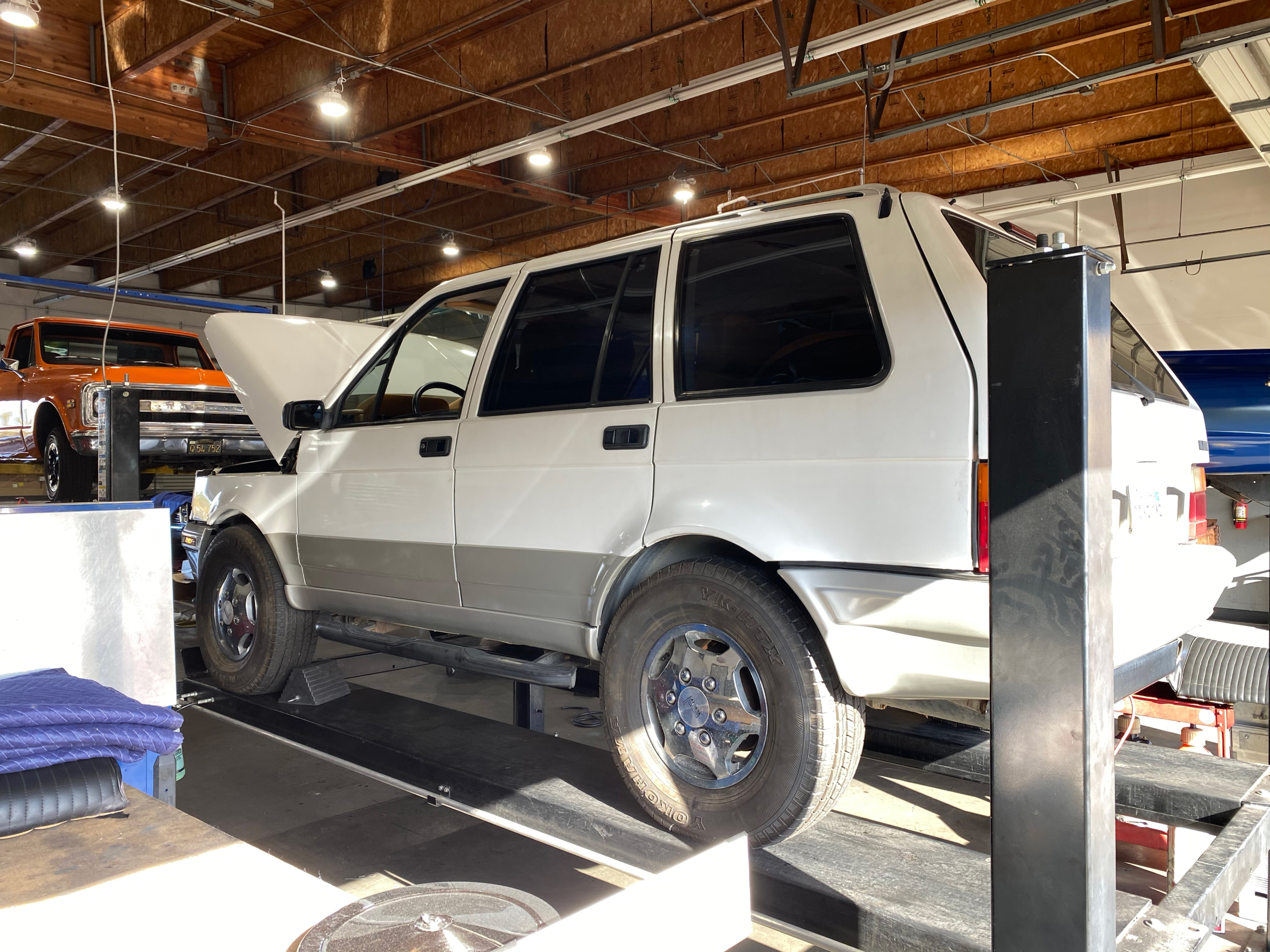 a Laforza on a lift at a shop
