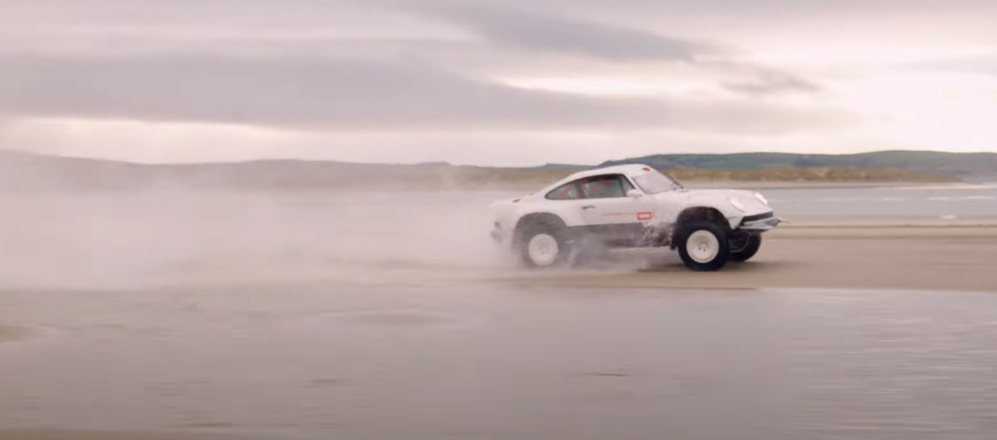 Singer ACS driving along a beach