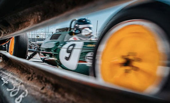 race car photographed between barrier