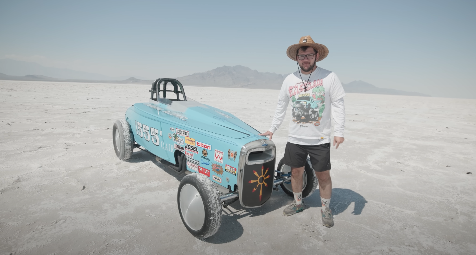 nolan sykes and his land speed race car at the bonneville salt flats